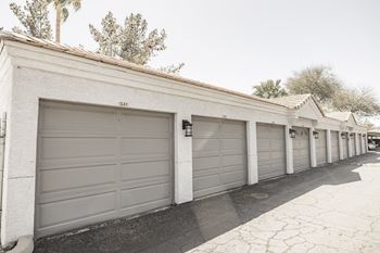 a row of garages with gray garage doors